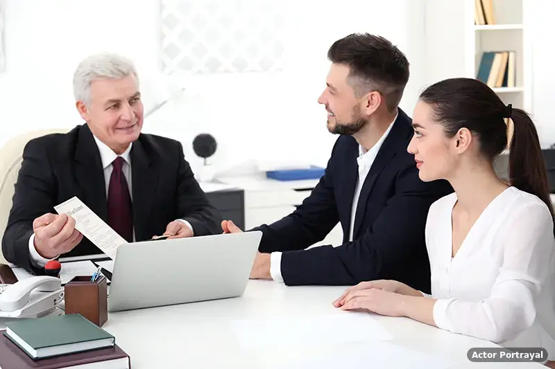 Attorneys meeting with a client to discuss case strategy at RockPoint Law (Actor Portrayal)