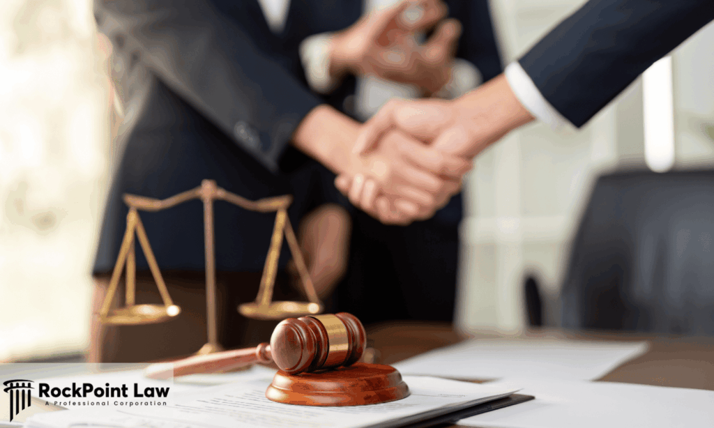 Attorneys shaking hands during a lemon law settlement negotiation