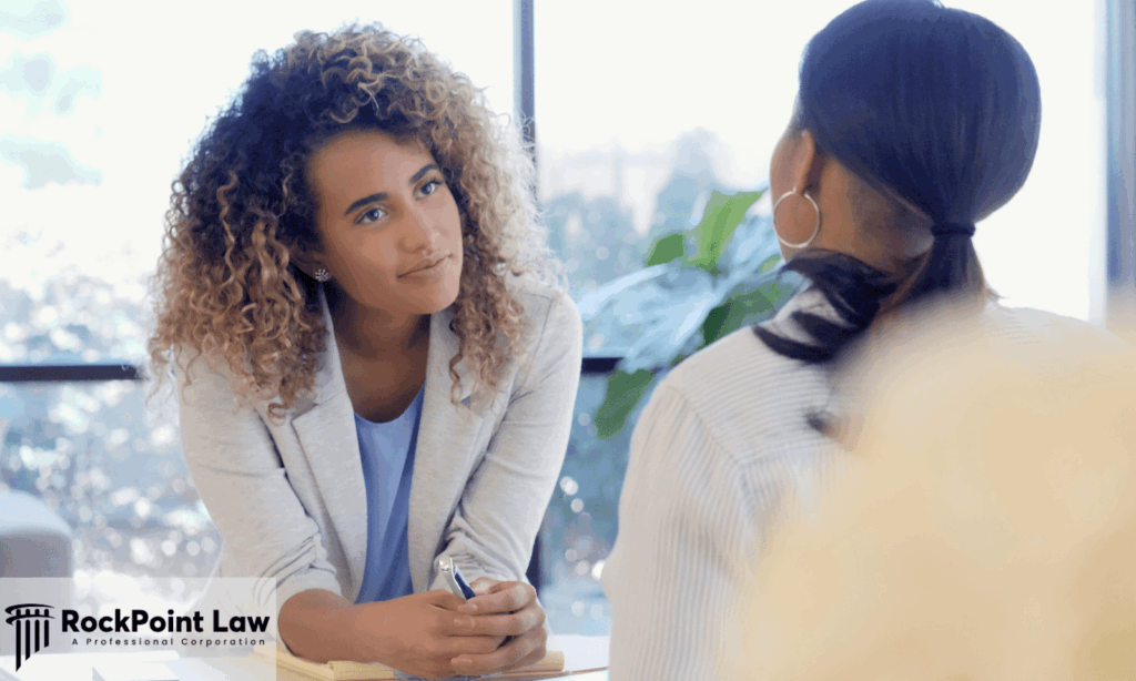 Attorney listening attentively to a client during a legal consultation