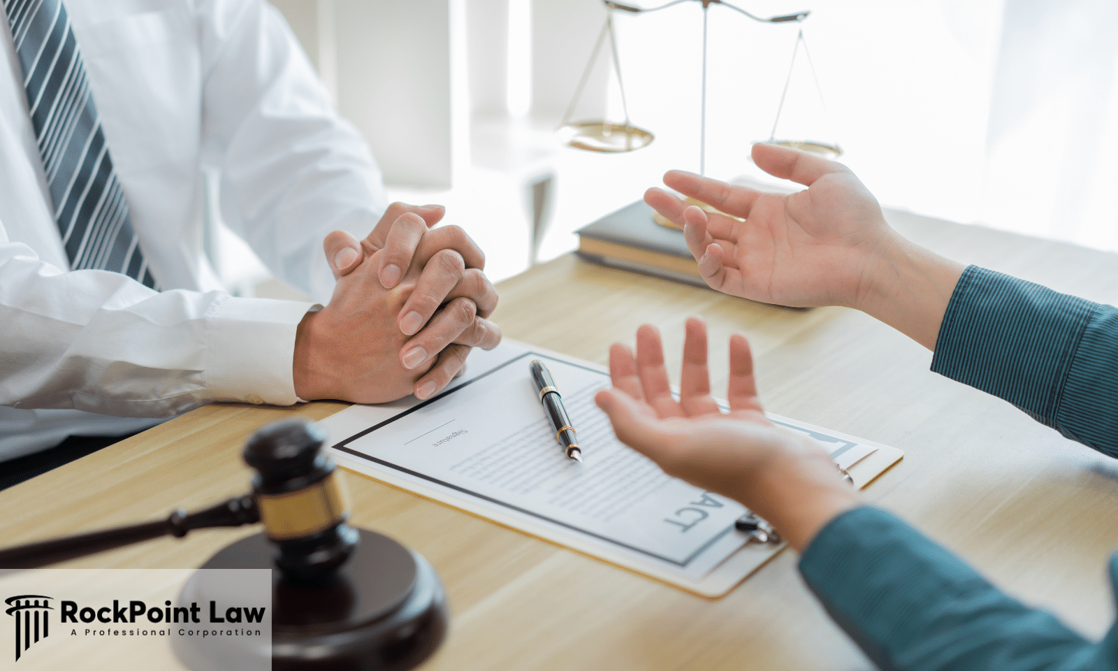 Attorney meeting with a client to discuss an Arkansas Lemon Law claim for a defective vehicle