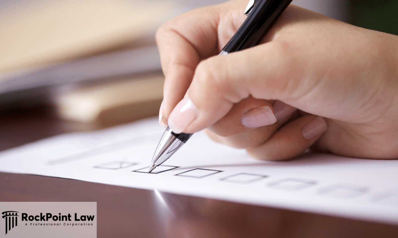 Close-up of a person completing a checklist on a claim form as part of the Delaware Lemon Law filing process.