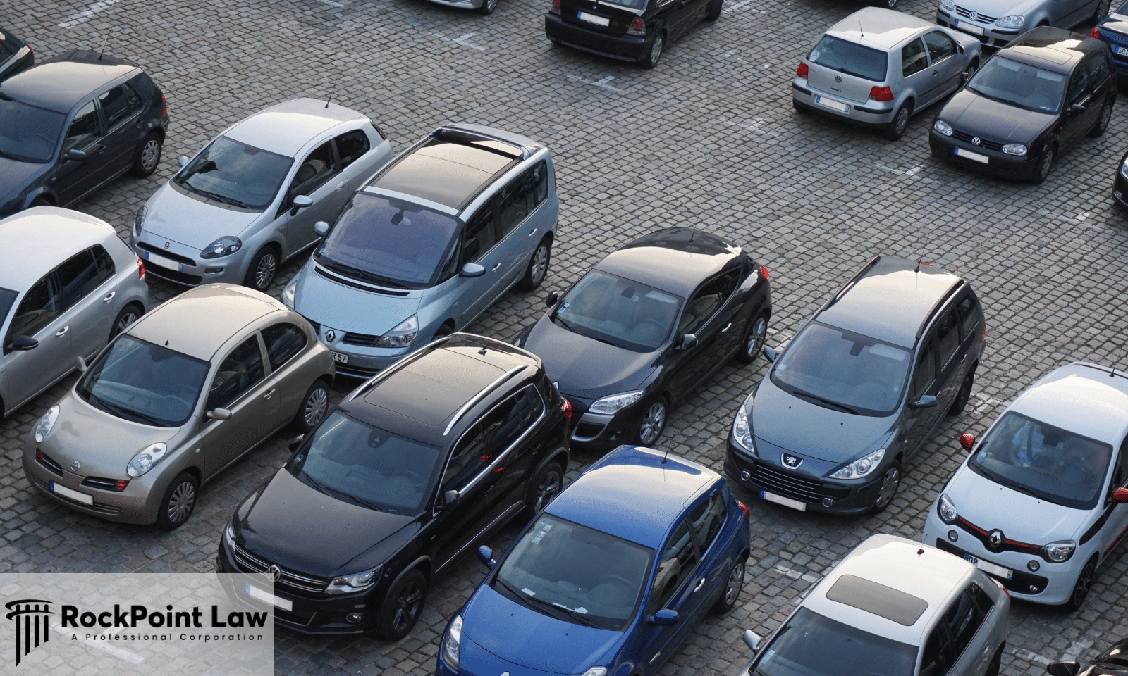 Rows of parked passenger vehicles representing new and used vehicles covered under Colorado Lemon Law