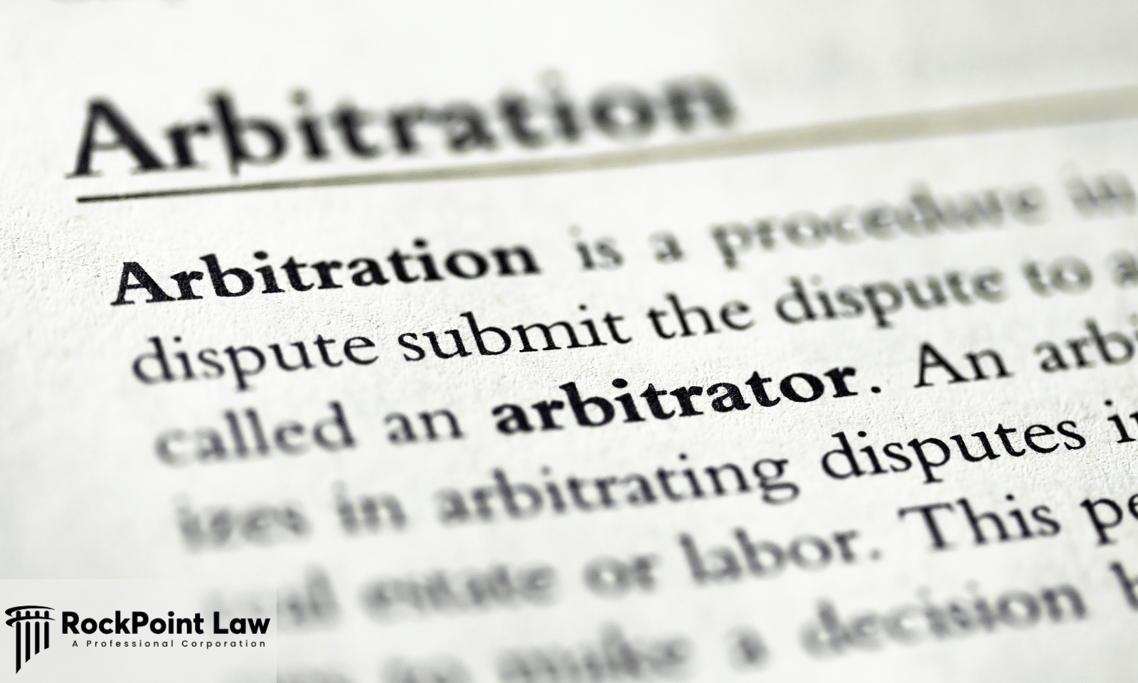 Close-up of a document defining arbitration, representing the dispute resolution process used in certain Florida Lemon Law claims.