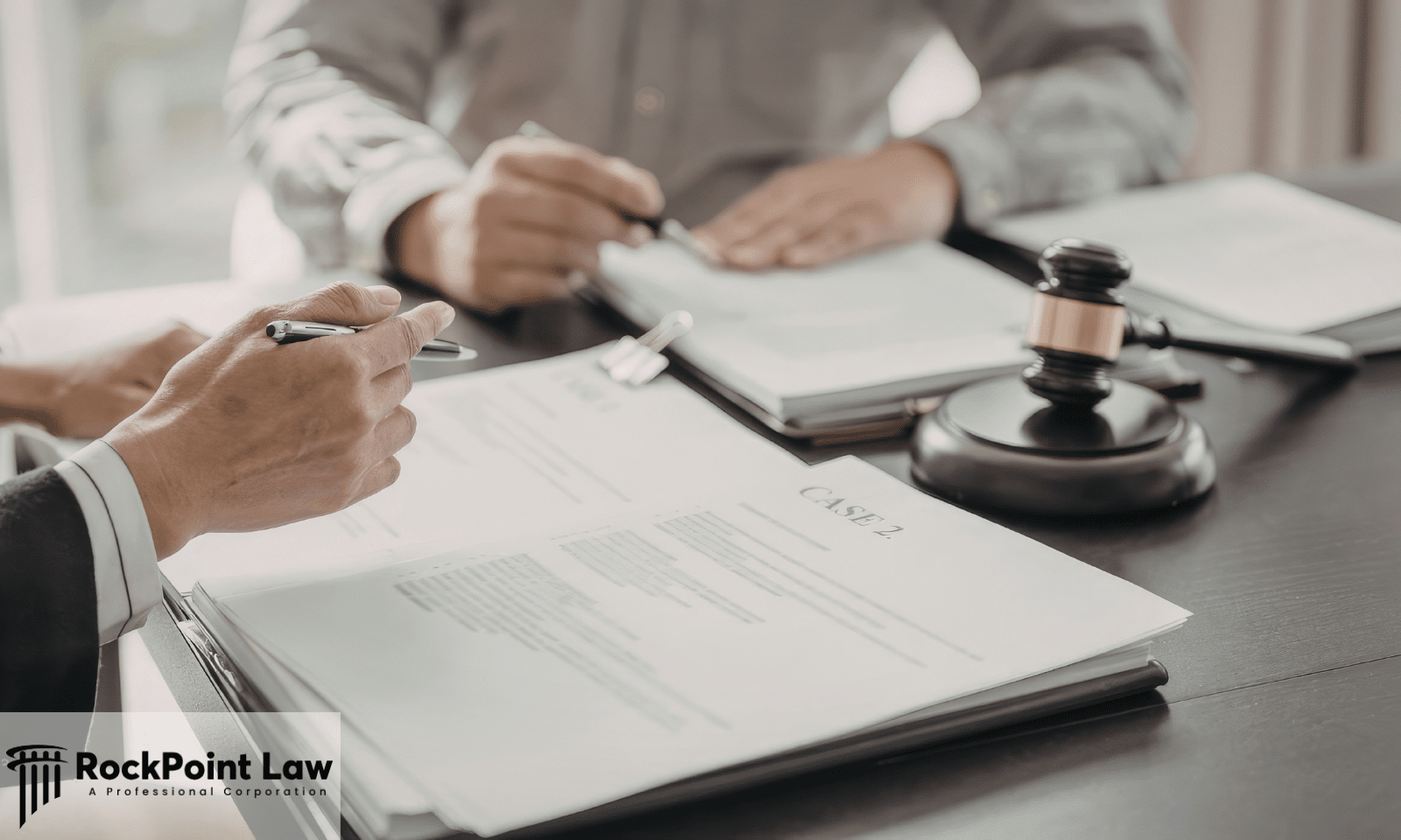 Attorney reviewing legal documents with a client during the Hawaii Lemon Law claim process.