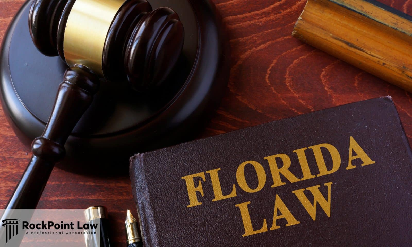 Florida law book and judge's gavel representing the Florida Lemon Law and consumer rights.