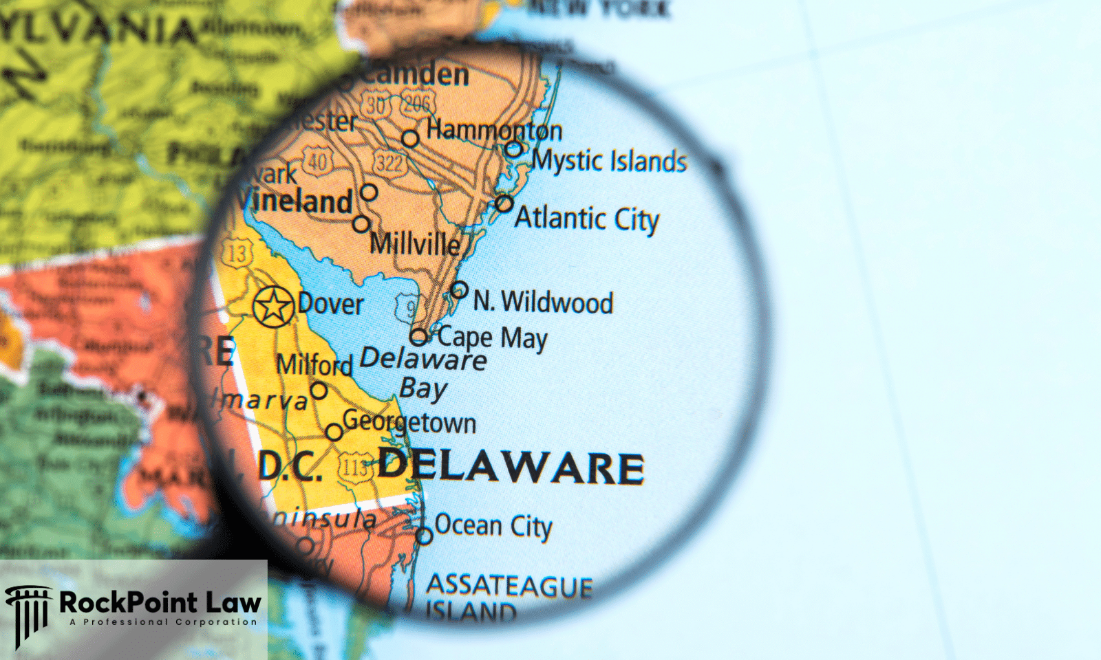 Magnifying glass highlighting the state of Delaware on a map, representing eligibility requirements under Delaware's Lemon Law.