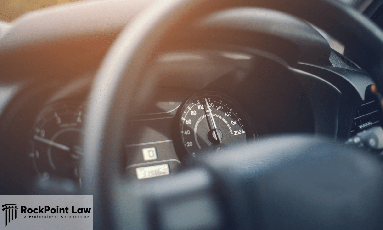 Close-up of a vehicle dashboard showing the speedometer and odometer used to document mileage in a lemon law claim