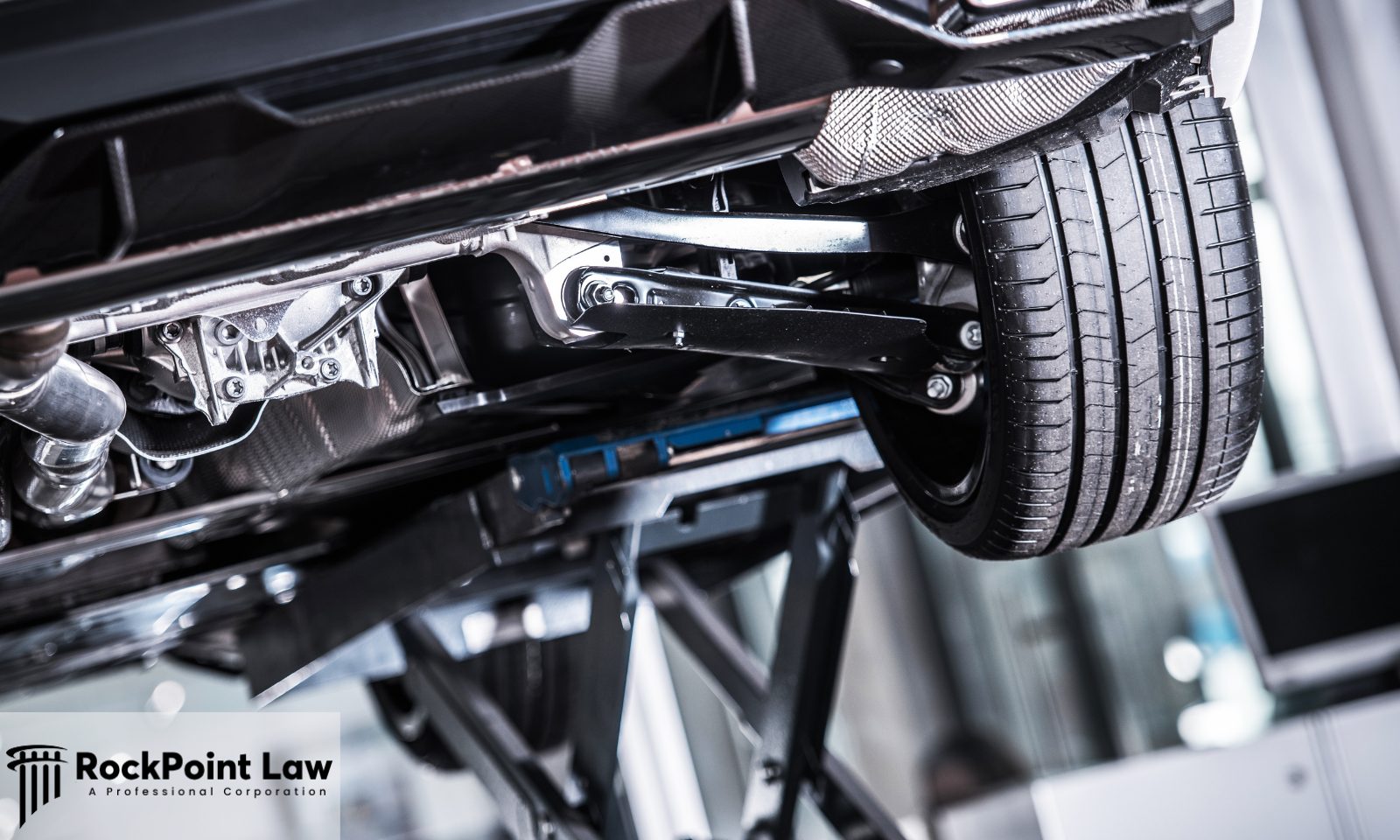 Close-up of a vehicle suspension and undercarriage during a professional safety inspection