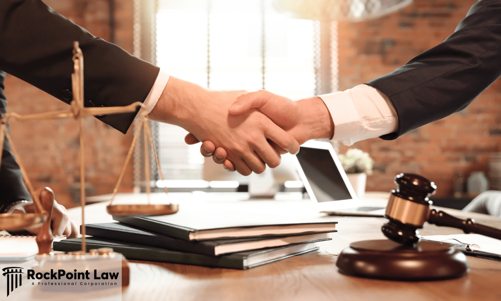 Legal professionals shaking hands after reaching a Lemon Law cash and keep settlement.