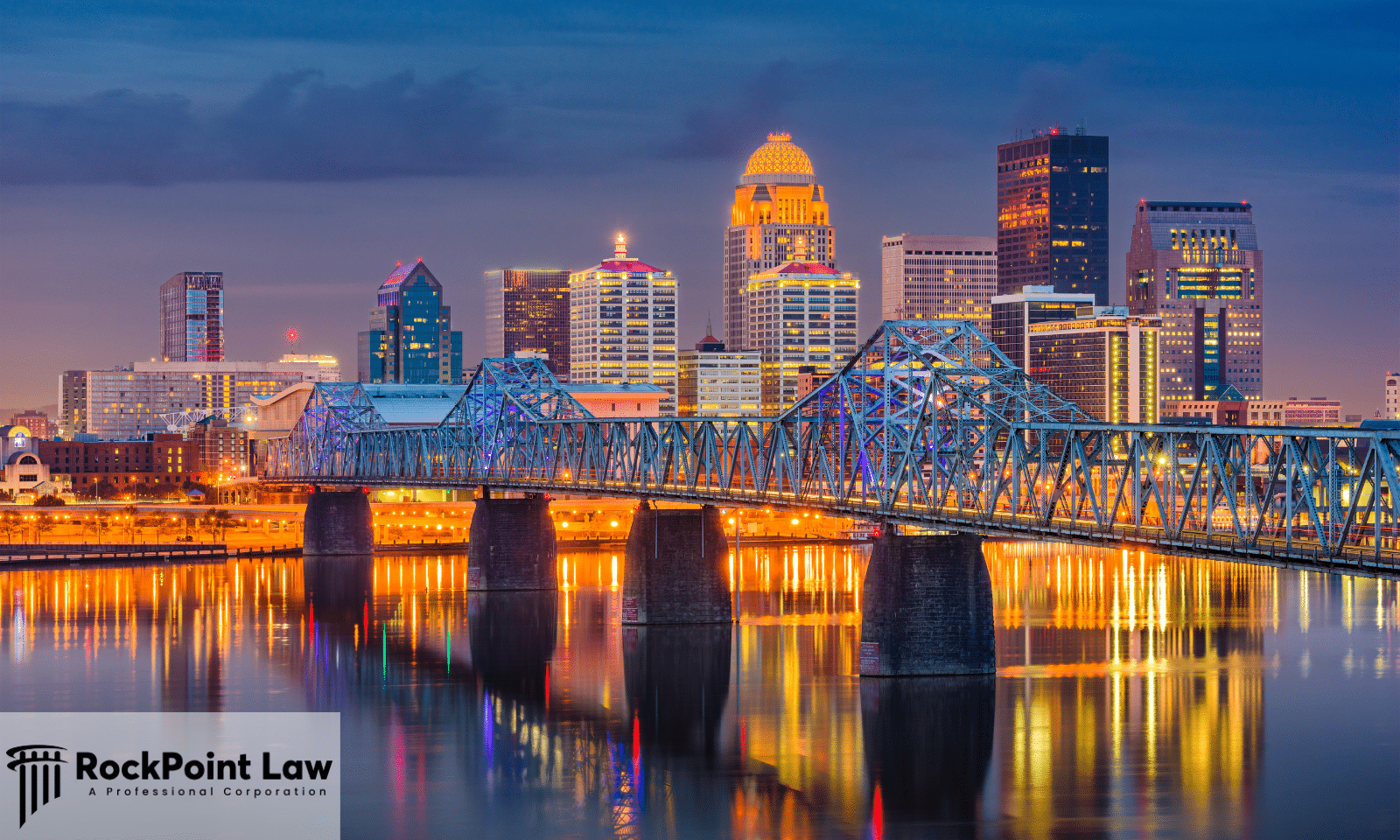 Louisville, Kentucky skyline at dusk with bridge over the Ohio River, representing Kentucky Lemon Law and consumer rights.