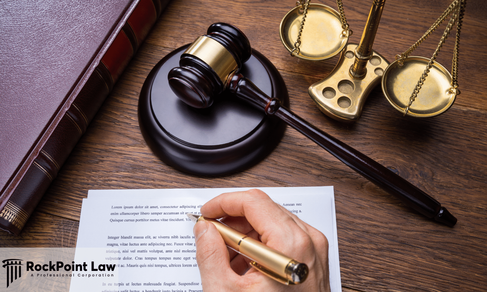 Person signing Louisiana Lemon Law claim documents beside a judge's gavel and scales of justice.