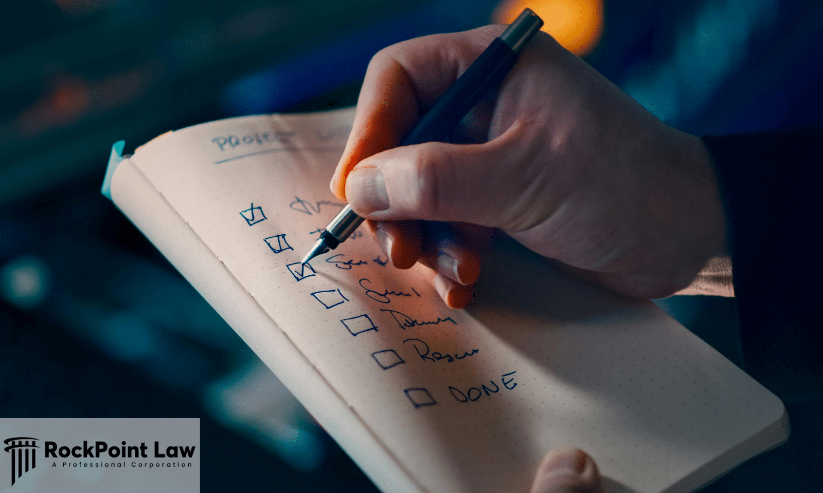 Person checking items on a checklist while preparing documents for a Lemon Law claim.