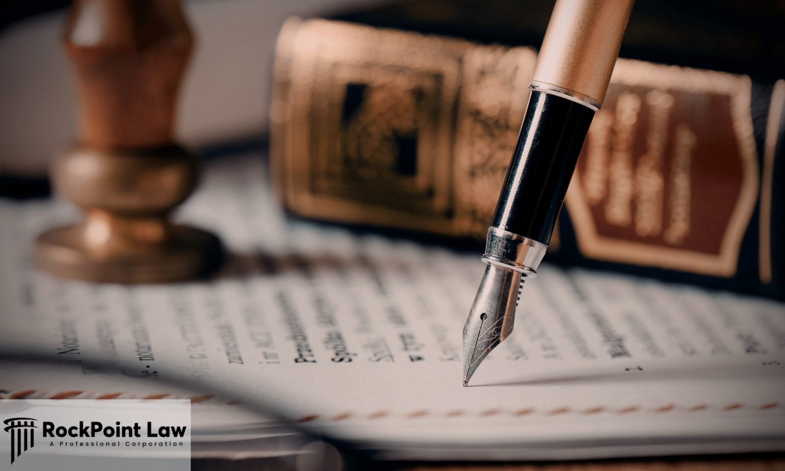 Close-up of a fountain pen poised over a legal document with a judge's gavel and law book in the background.