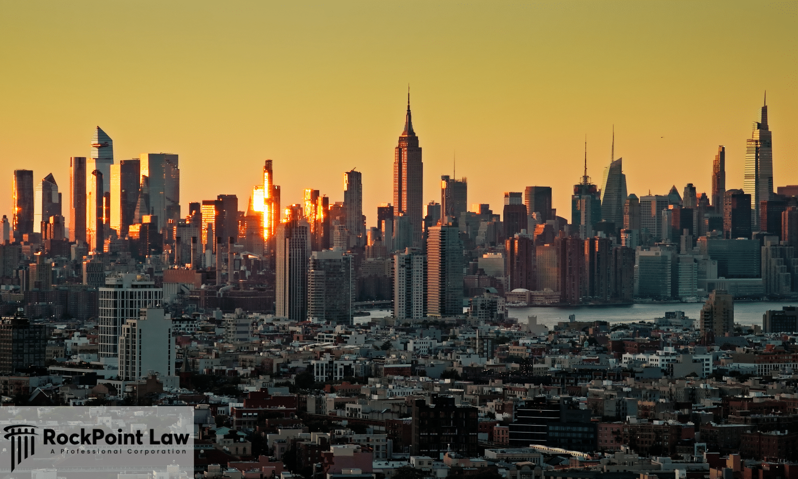 Manhattan skyline at sunset with the Empire State Building, illustrating a guide to New York lemon law.