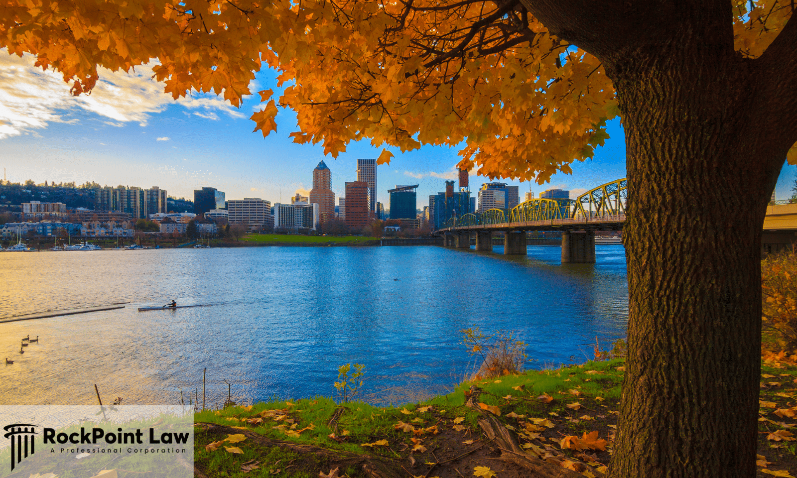 Portland skyline along the Willamette River in autumn, where Oregon lemon law protects new vehicle buyers and lessees