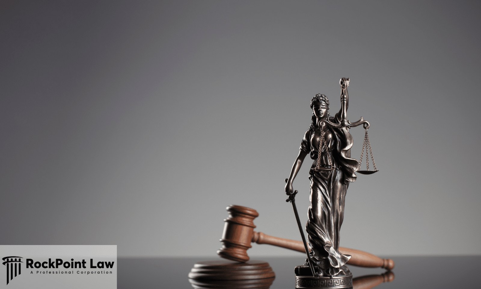 Statue of Lady Justice with the scales beside a wooden gavel, representing Pennsylvania lemon law claim outcomes
