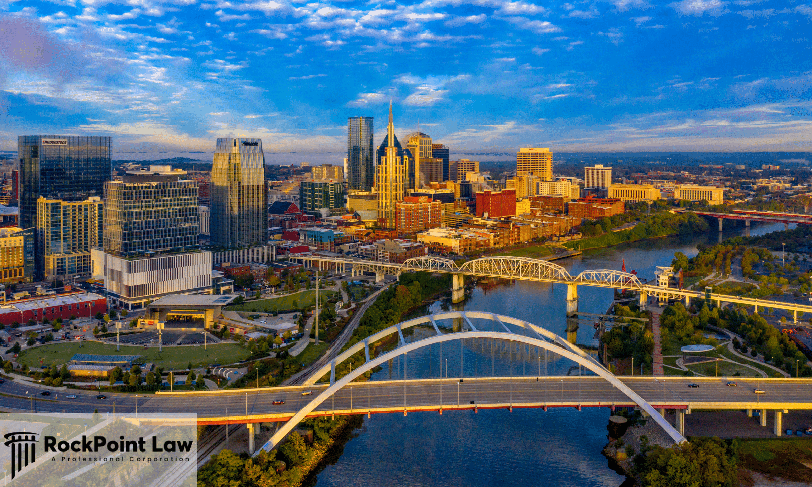 Nashville skyline and the Cumberland River bridges at sunrise, where Tennessee lemon law protects new vehicle buyers and lessees
