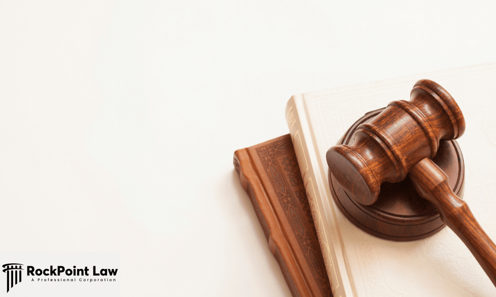 Gavel resting on a law book, representing examples of Washington Lemon Law claims and arbitration outcomes.