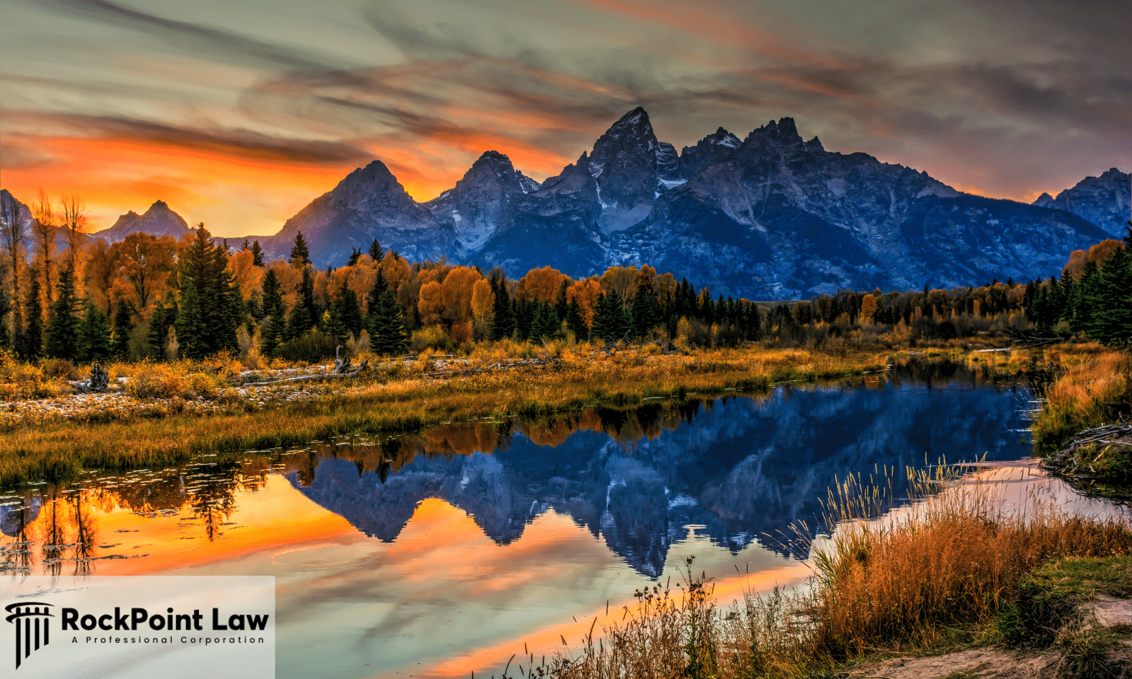The Teton Range reflected in the Snake River at sunset in Wyoming, the state whose Lemon Law covers defective new vehicles.